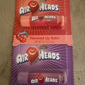 Air head flavored lip balm in grape and cherry
